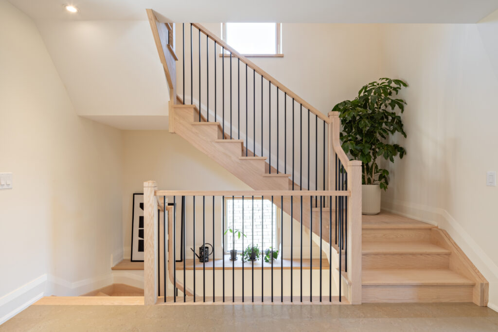 Front view of staircase to the top and bottom floors.